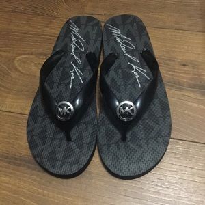 Black Michael Kors flip flops